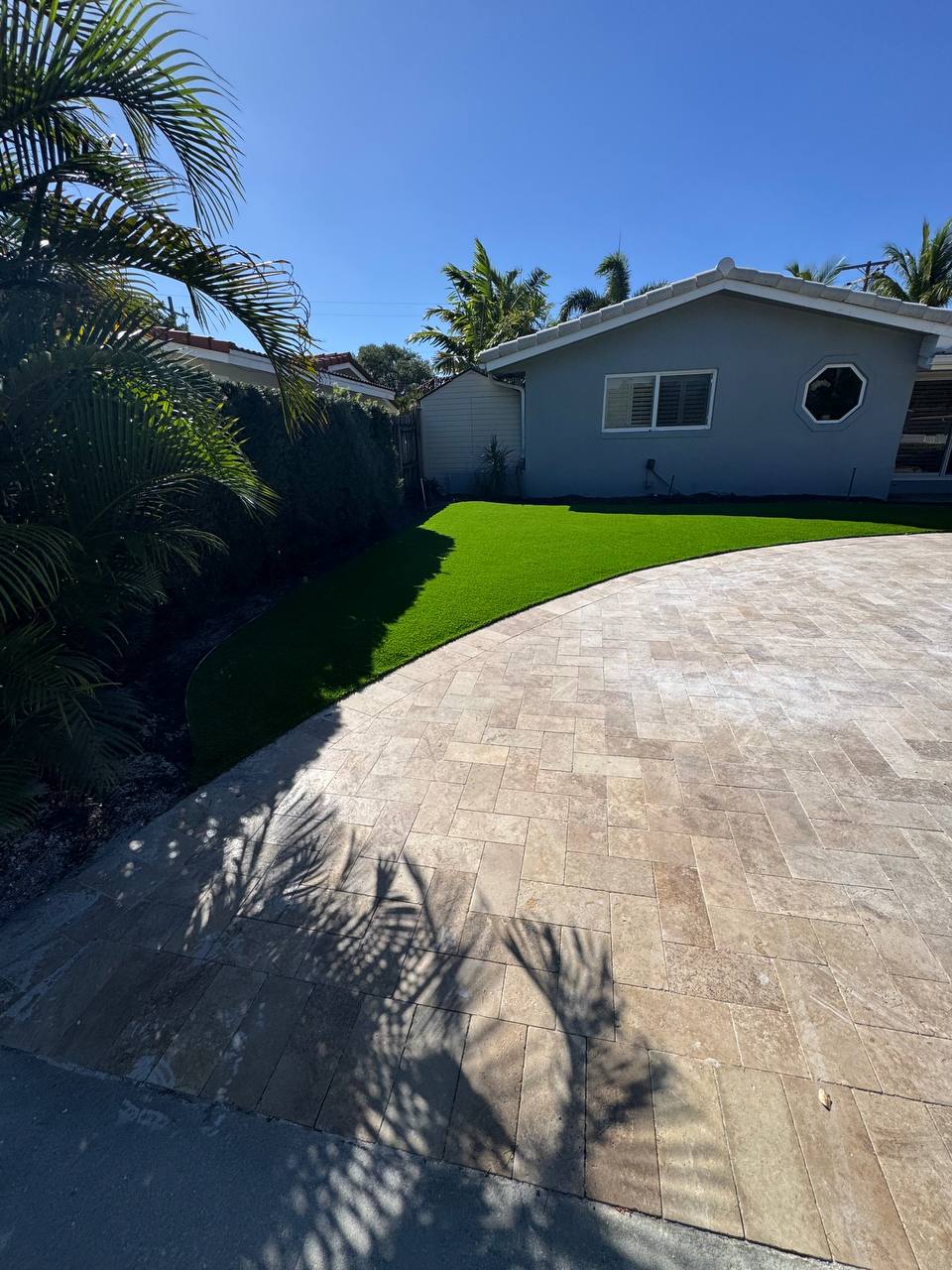 Professional custom putting green installation in residential backyard